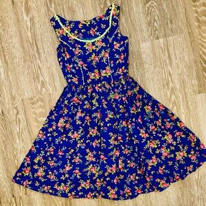 Vintage blue floral A-line dirndl dress with circle skirt and green trim